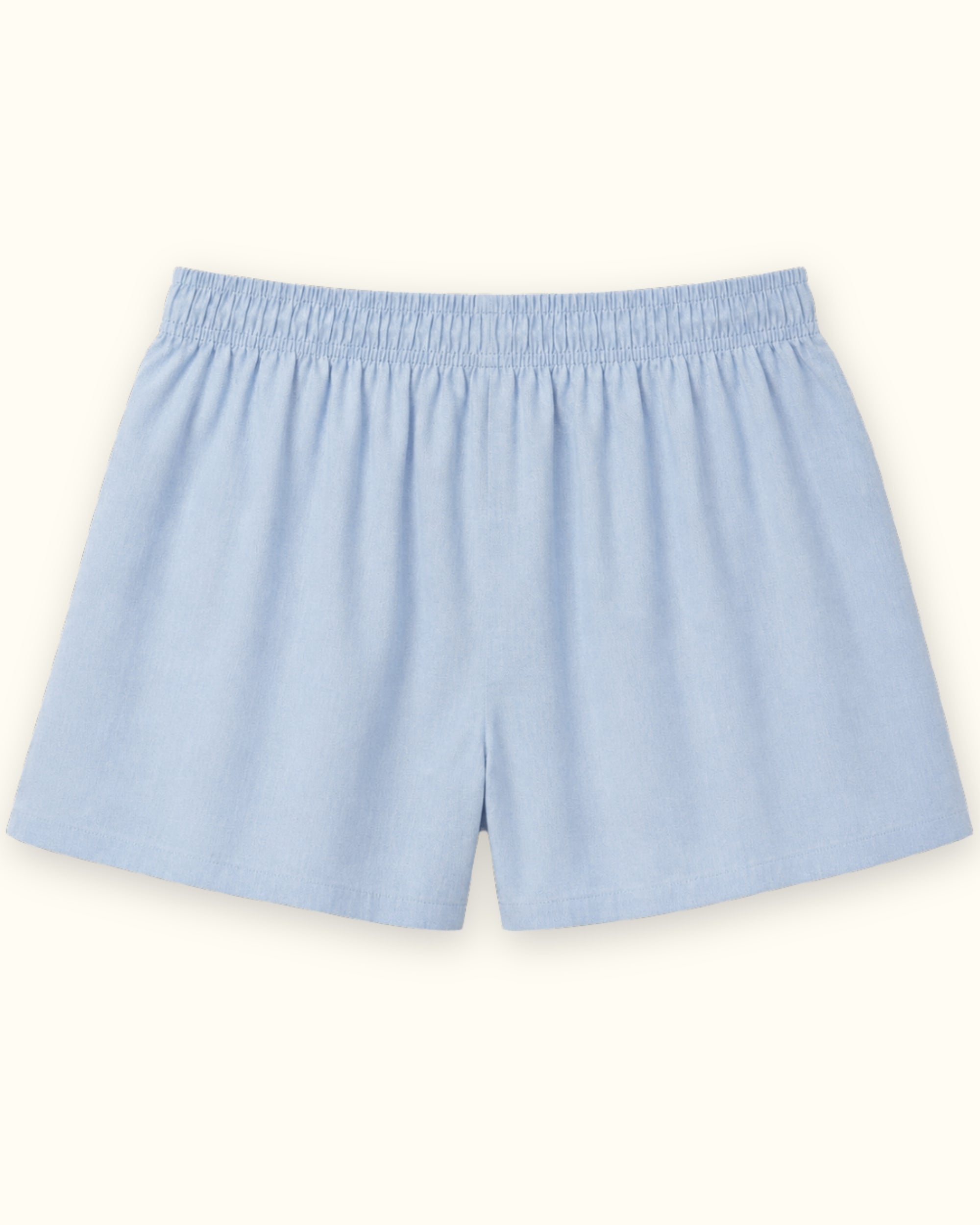 Shorts boxer in cotone azzurri, vista posteriore, con vita e linea della gamba