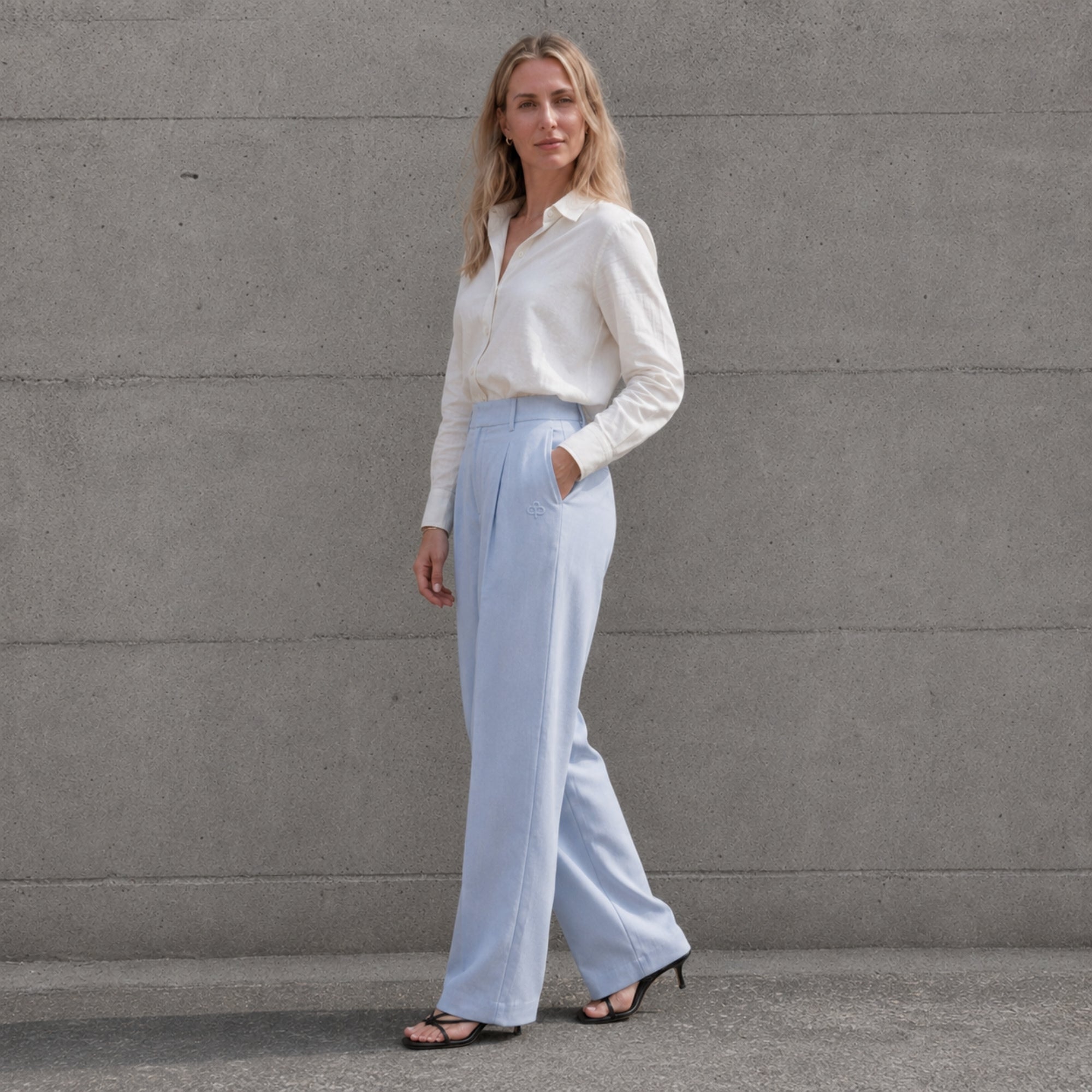 Straight Leg Linen Pants in Light Blue, lifestyle view 2, showing pleats and straight leg shape