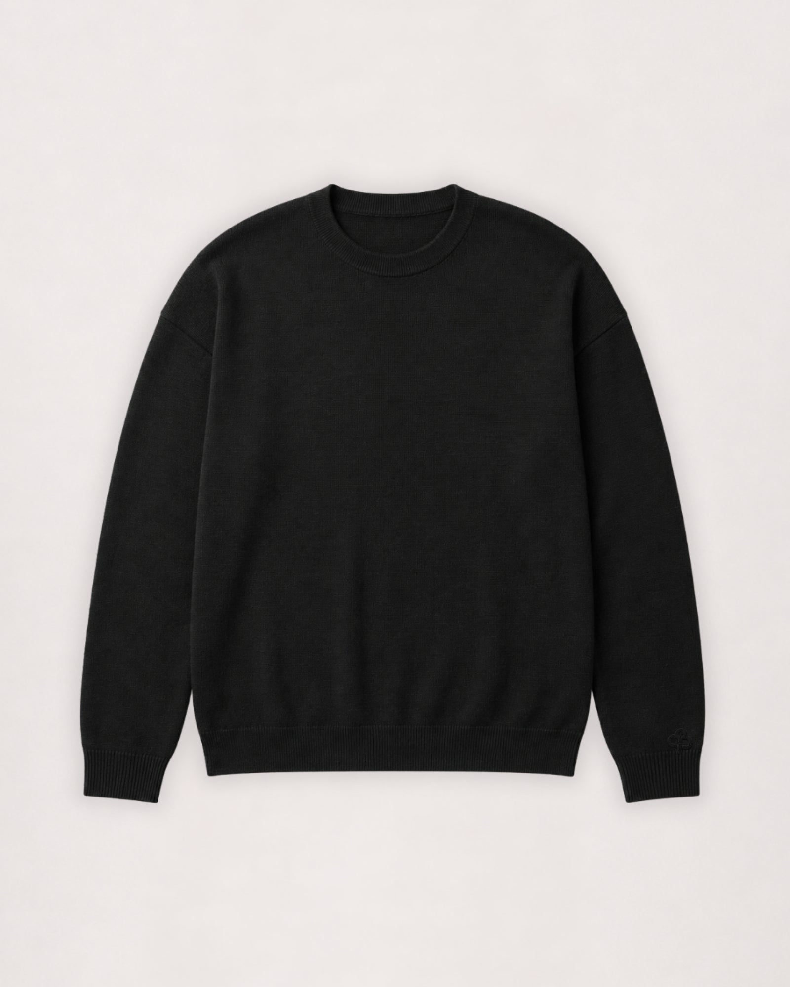 Pull à col rond en laine mérinos noir, vue à plat de face
