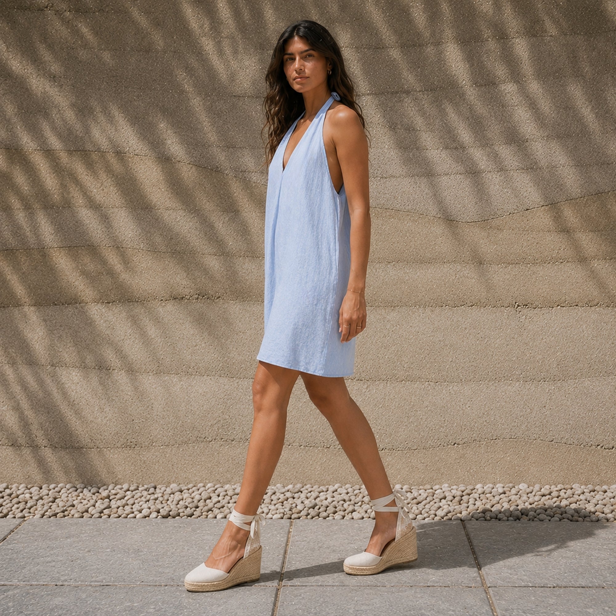Linen Halter Dress in Light Blue, lifestyle view 1, showing neckline and dress silhouette