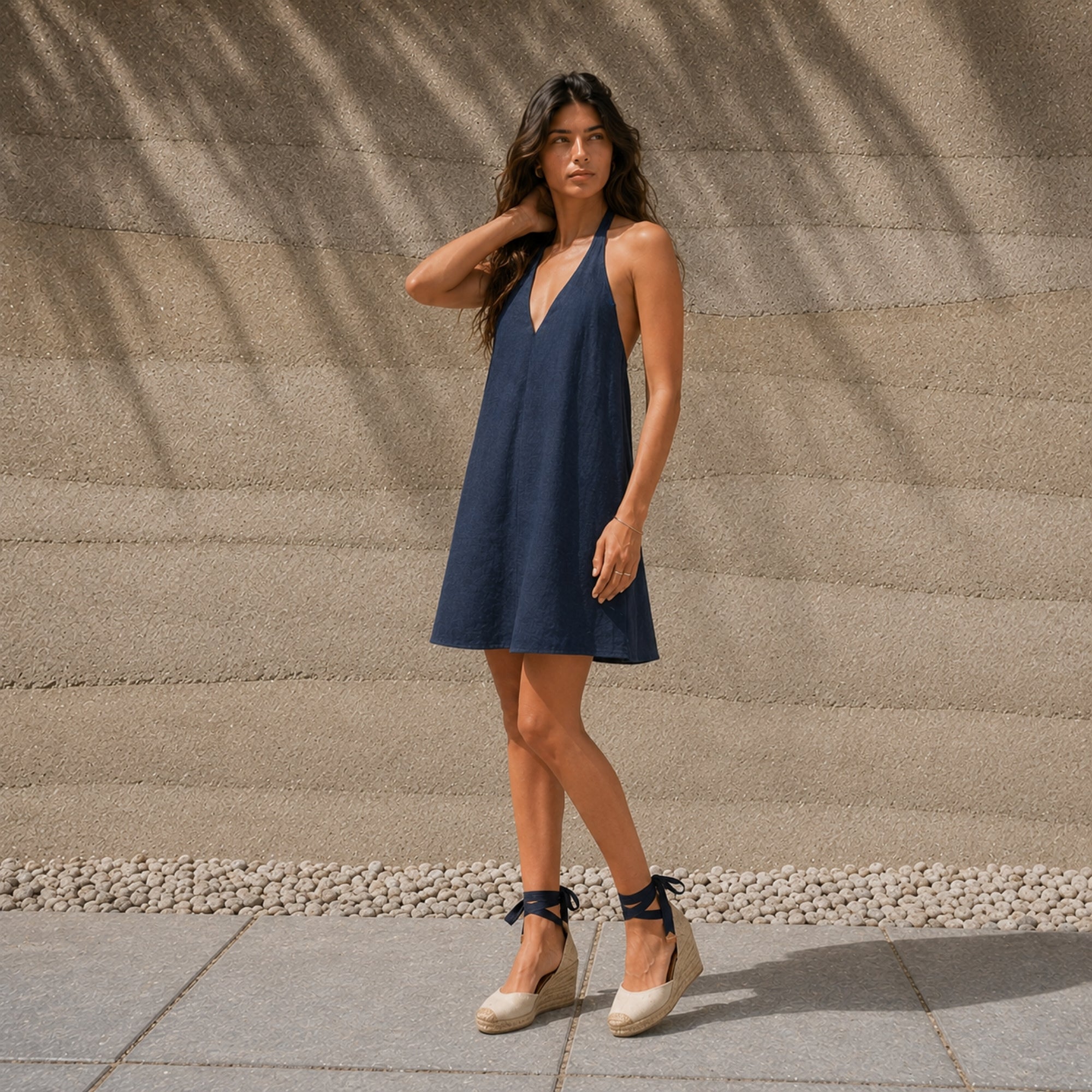 Linen Halter Dress in Navy Blue, lifestyle view 2, showing neckline and dress silhouette