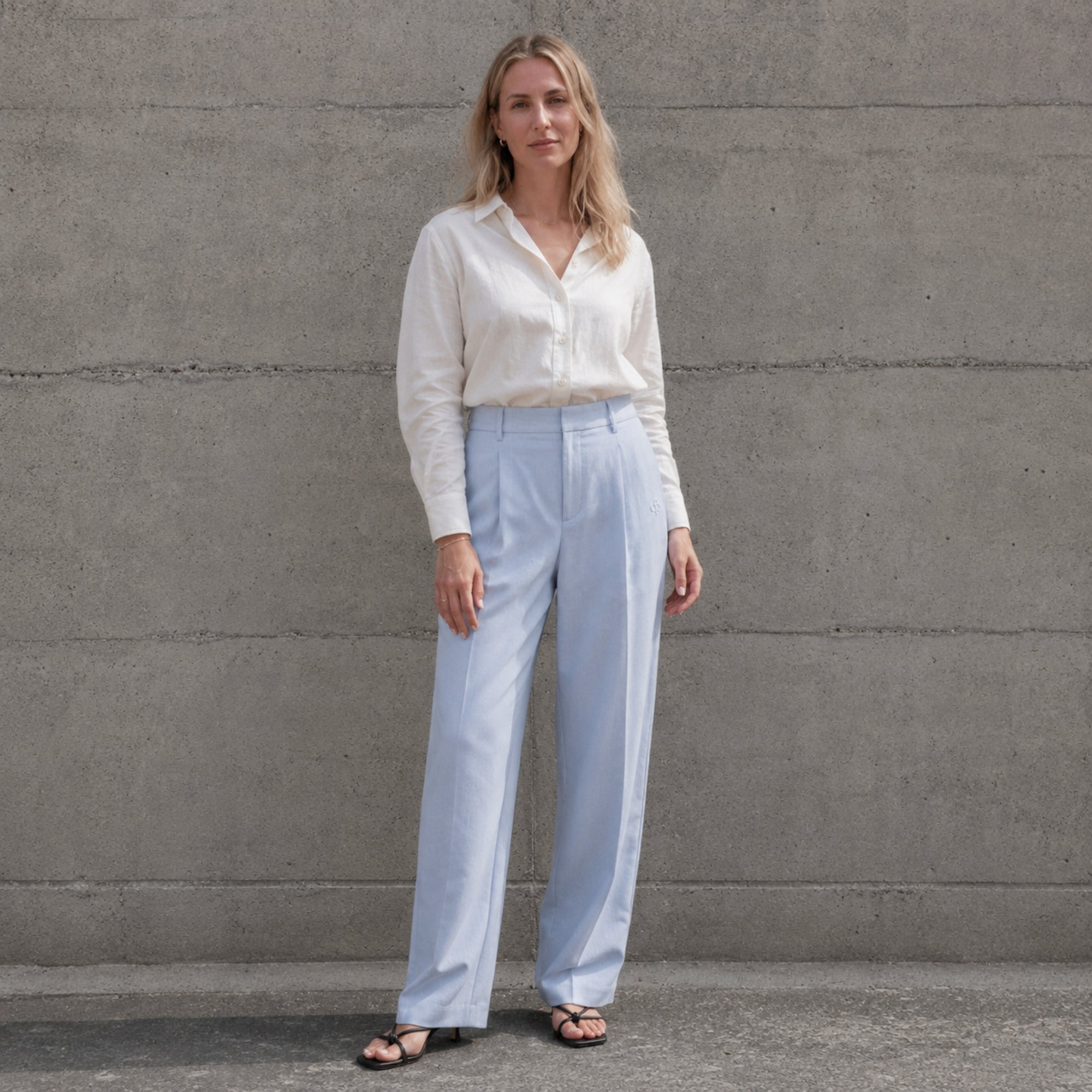 Straight Leg Linen Pants in Light Blue, lifestyle view 1, showing pleats and straight leg shape