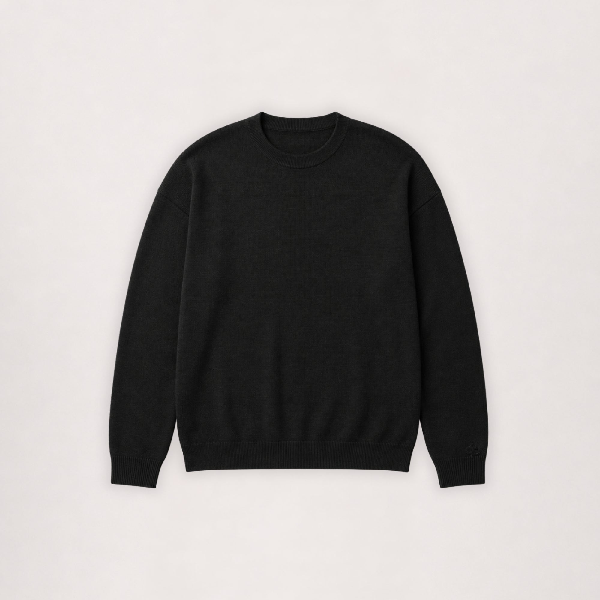 Pull à col rond en laine mérinos noir, vue à plat de face